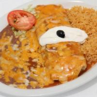 Burrito Ranchero · A bean and cheese burrito topped with ranchero sauce, melted cheese and sour cream. Served w...