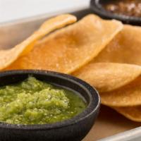 Chips And Salsa · red (spicy roasted tomato) and green (mild tomatillo) salsas
