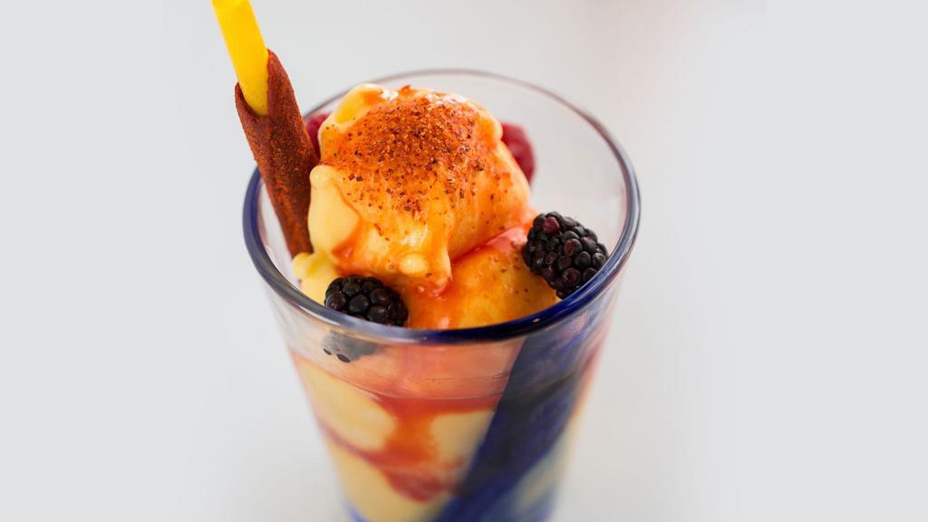 Mango Sorbet · Berries, tajin, tamarind straw, chamoy