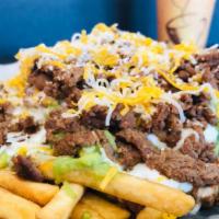 Carne Asada Fries · Fries cooked crispy, topped off with melted cheese, guacamole, sour cream & Carne Asada