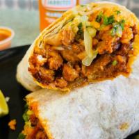 Super Burrito · Choice of meat rice, beans, guacamole, sour cream, onion, cilantro & cheese.
