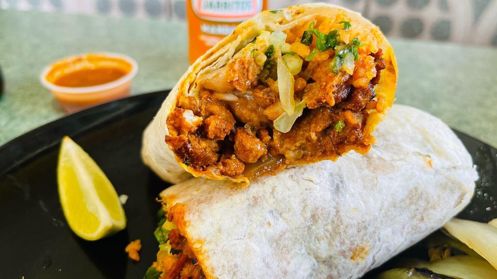 Super Burrito · Meat, rice, beans, guacamole, sour cream, onion, cilantro, and cheese