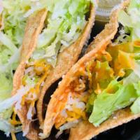 Crunchy Tacos · Served with lettuce & cheese.