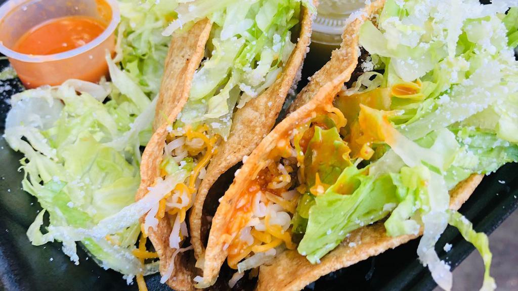 Crunchy Tacos · Served with lettuce & cheese.