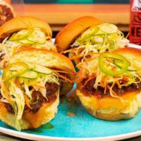 Pot Roast Sliders And Garlic Fries · Two sliders, slow-cooked premium chuck roast, napa cabbage slaw, cheddar cheese, and our del...