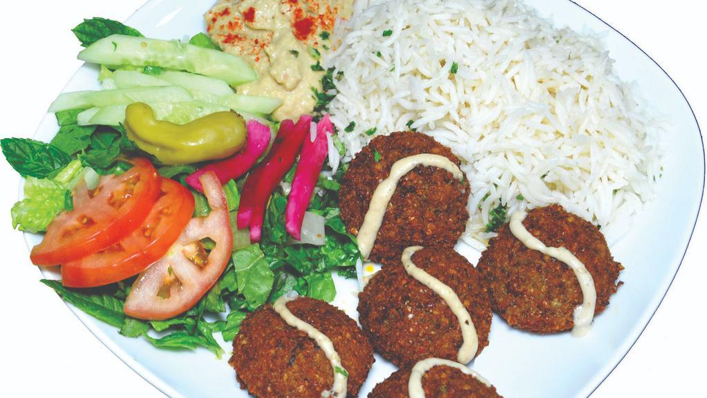 Falafel Plate · Vegetarian. Plain or dill rice, five falafel, any choice of salad, hummus, tzatziki, garlic sauce, hot sauce, olive, and pita bread.