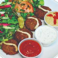 Falafel Salad · Vegetarian. Five falafel with any choice of salad, hummus, tzatziki, olive, garlic sauce, an...