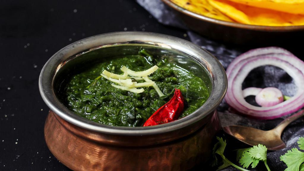 Saag · Silky and smooth, finely chopped spinach cooked down with onions, cinnamon, cloves, ginger, chili, garlic, coriander, and cumin. Add one of our freshly baked breads and tempting starters!
