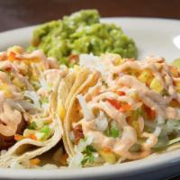 Mahi Fish Tacos (2) · Mahi sauteed in tomato water, served on two corn tortillas and topped with a cabbage mango s...