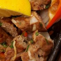 Seekh Kabob · Ground lamb seasoned with onions, green chili, & mixed with herbs & spices.