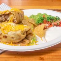 Chimichanga Burrito Beef · Filled with beans. Served in a bed if lettuce and topped with Mex. salsa, cheddar & cotija c...