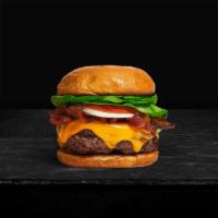 Boom Boom Bacon Burger · Beef patty, bacon, lettuce, tomato, onion, pickles, mayo, and melted cheddar cheese on a bri...