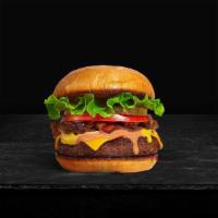 Classic Basic Burger · Beef patty topped with lettuce, tomato, onion, and pickles on a brioche bun.