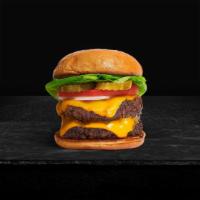 Double Trouble Cheese Burger · Two beef patties, lettuce, tomato, onion, pickles, mayo, and melted cheddar cheese on a brio...