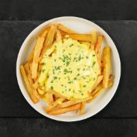 Cheesy Chaser Fries · Idaho potato fries cooked until golden brown and garnished with salt, melted cheddar cheese,...