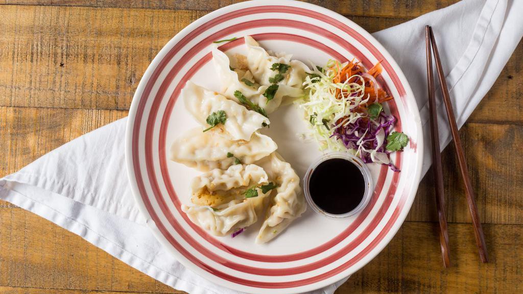 Dumplings (Steamed) · Your choice of chicken (6), pork (6), or veggie (5) dumplings served with a soy vinegar sauce.