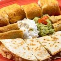Fiesta Plate · A combination of crispy taquitos, chimichanga and quesadilla. Made with your choice of beef ...