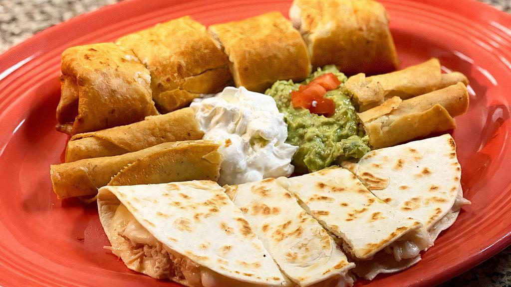 Fiesta Plate · A combination of crispy taquitos, chimichanga and quesadilla. Made with your choice of beef or chicken. Served with guacamole and sour cream.
