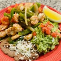 Shrimp Fajitas · Juicy grilled shrimp with a hint of garlic butter. Grilled with bell peppers, onions, and to...