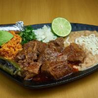 Birria Res Plate (Beef) · A dish made of stewed beef meat. Served with rice and refried beans. Includes four corn tort...