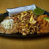 Huevos Con Chorizo · Scrambled eggs mixed with chorizo sausage, served with a side of rice, refried beans, and av...
