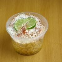 Elote Mexicano · grains of corn served in a cup, topped with liquid butter, mayonnaise, cotija cheese, lemon ...