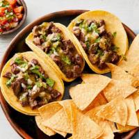 Asada Taco Platter · 3 tacos served with fresh tortilla chips & pico de gallo