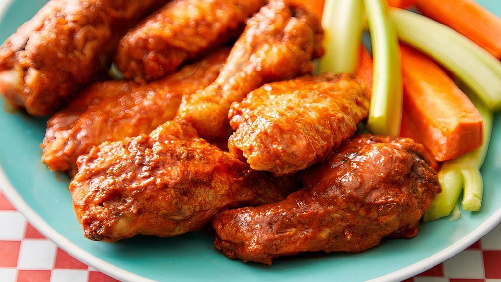 Sweet And Spicy Hot Wings · Tossed with our secret sauce served with ranch dressing, celery, and carrots.