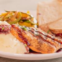 Grilled Salmon · Red wine reduction sauce, mashed potato, grilled seasonal veggies.