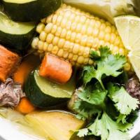 Caldo De Res · Beef Stew, with mixed veggies, served with cilantro, onion, lemons and corn tortillas.