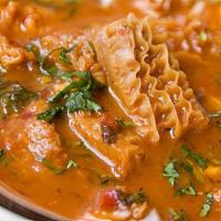 Menudo · Beef tripe broth with a red chili pepper base. Side of lime, chopped onions, cilantro, crush...