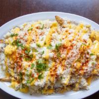 Elote Fries · House cut fries, shaved corn, mayo, queso cotija, cilantro, butter, chili powder and cilantro.