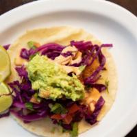 Fish Taco · Handmade tortilla, grilled or beer battered fish tilapia baja style, topped with pickled cab...