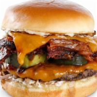 Bacon Bbq Burger · Chuck Angus prime burger, bacon, cheddar cheese, red onion, pickles, and BBQ sauce.