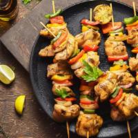 Chicken Kabob · A skewer of your choice of fresh grilled seasoned chicken thigh or breast over a bed of saff...