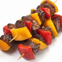 Shish Kabob · A skewer of fresh grilled seasoned pieces of beef over a bed of saffron rice and pita bread....