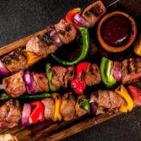 Beef Louleh Kabob · A skewer of fresh grilled seasoned ground beef over a bed of saffron rice and pita bread. Co...