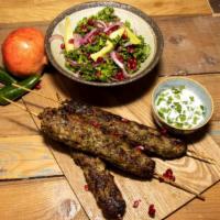 Lamb Kabob · A skewer of fresh grilled seasoned pieces of lamb over a bed of saffron rice and pita bread....