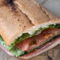 Italian Hero Sandwich · Provolone cheese, Genoa salami, pepperoni, smoked ham, real mayonnaise, romaine lettuce, tom...