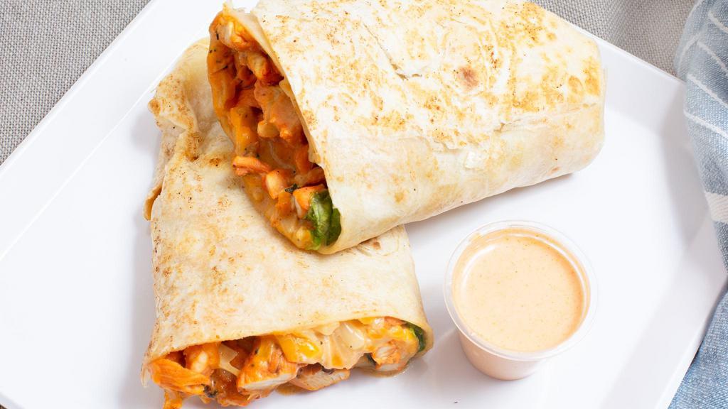 Grilled Chicken Wrap · Chicken marinated with special spices and vegetables, served in a wrap.