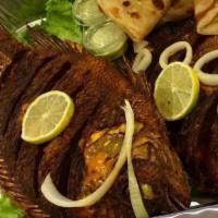 Tilapia Fish · Deliciously deep fried whole tilapia made simple with peppers and onions.