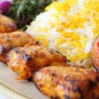 Chicken Tikka Plate · Marinated chicken tender served with grilled tomatoes, garlic sauce, and freshly baked house...