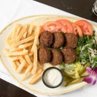 Falafel Plate · Falafel served with pickles, tahini sauce, and freshly baked house bread.