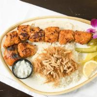 10 Skewers Of Chicken Tikka W/Rice · Served with rice, grilled tomatoes, and Pita bread.