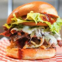 The Cowboy · Bacon, pepper jack, sautéed jalapenos, onion straws, lettuce, tomato and bbq sauce on a butt...