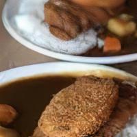 Chicken Katsu · Panko breaded cutlet. Served with rice, miso soup,
salad and gyoza.