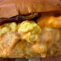 Pop!S Breakfast Sando · scrambled eggs w chives, american cheese, bacon, pop’s secret sauce, brioche bun