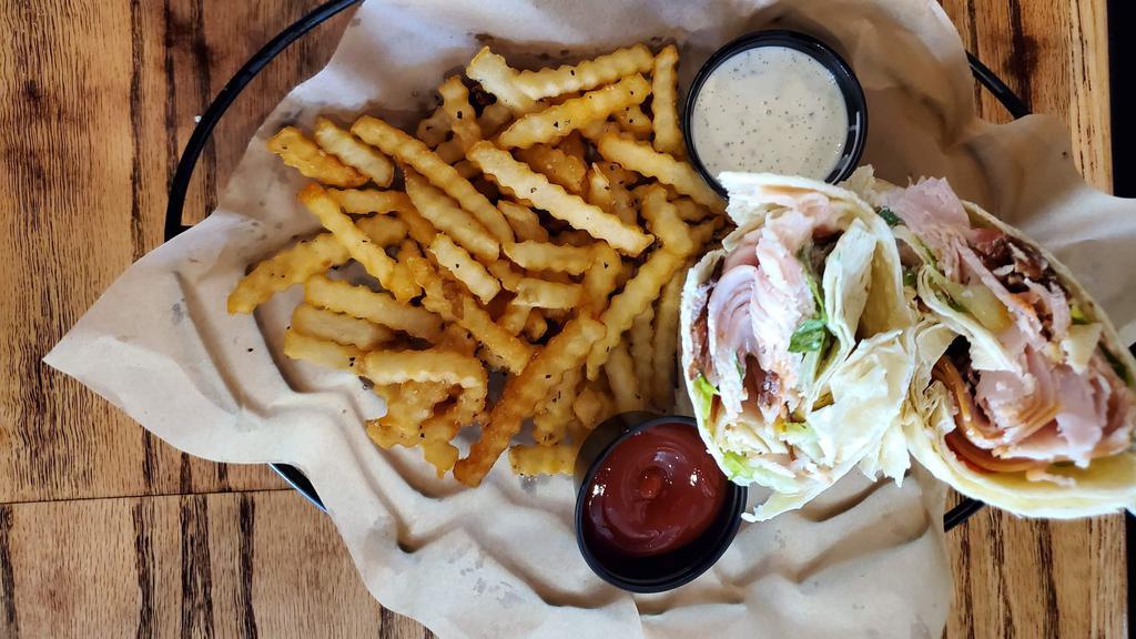 Chicken Club Wrap  · Aged cheddar cheese, Applewood bacon, tomato, lettuce, mayo in
a flour tortilla with ranch dressing (1590 CAL.)