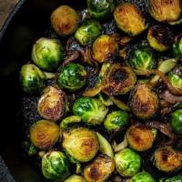 Brussels Sprouts · Baked & tossed in garlic butter with fire roasted
red peppers (490 CAL.)