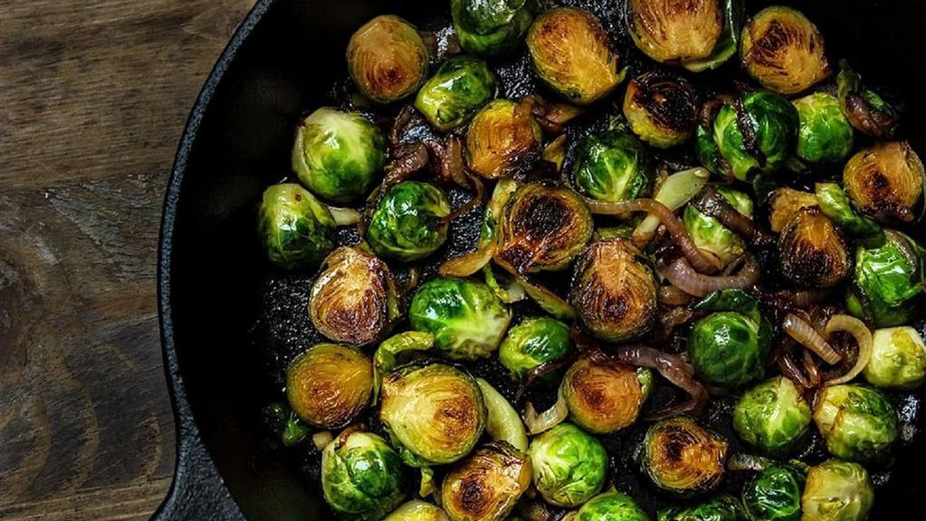 Brussels Sprouts · Baked & tossed in garlic butter with fire-roasted red peppers (490 CAL.).